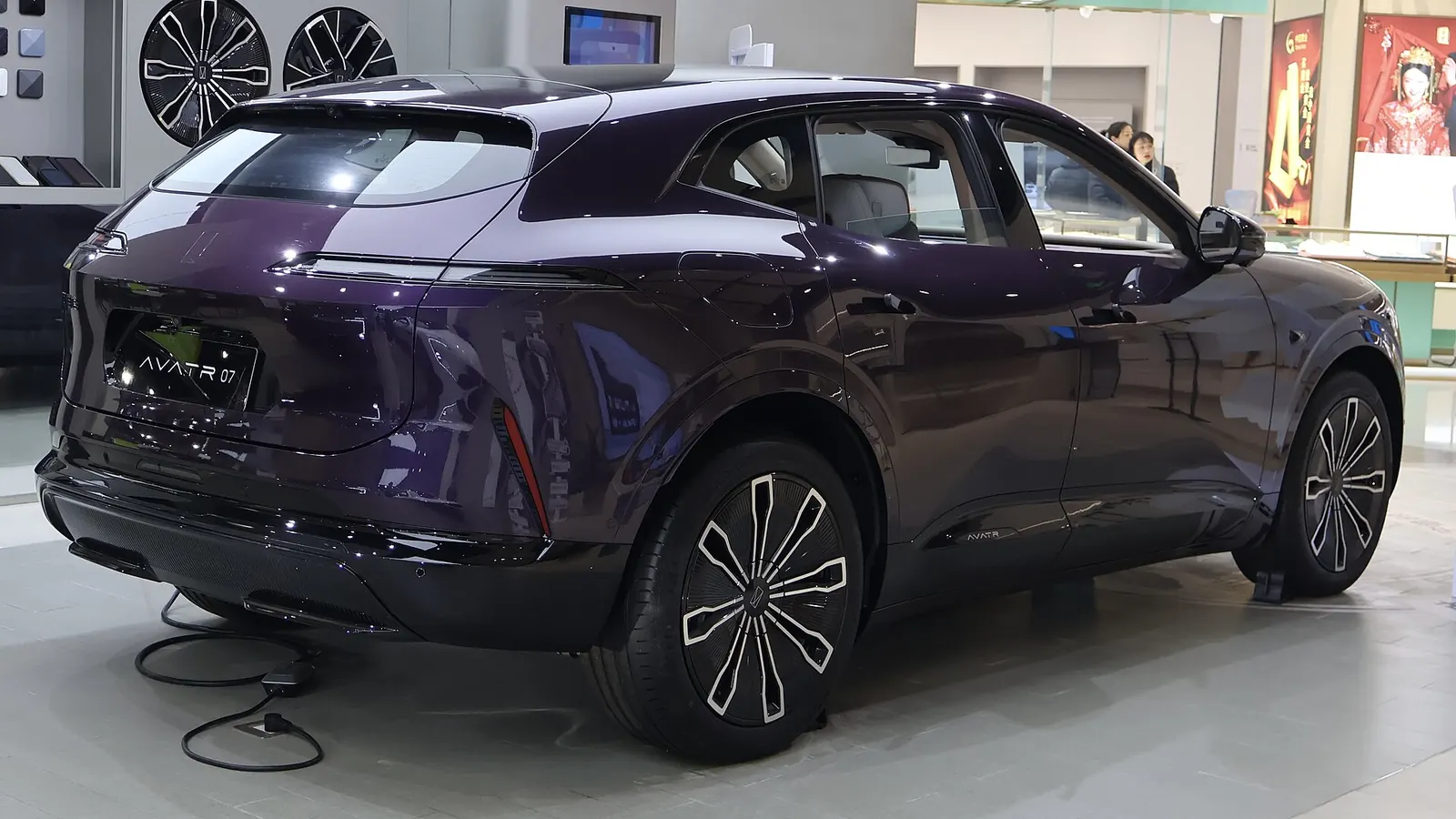 Rear three-quarter view of a purple Avatr 07 with the slim tail-light and aero wheels