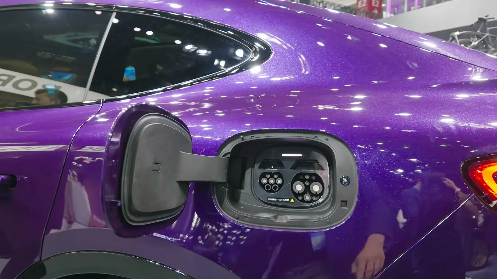 Charging flap of the China-market Luxeed R7 open, showing two GB/T sockets